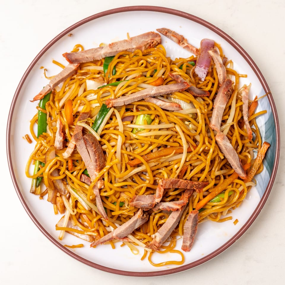 Mei Lai Xuan's Chinese chow mein with sliced pork, bean sprouts, and green onions.